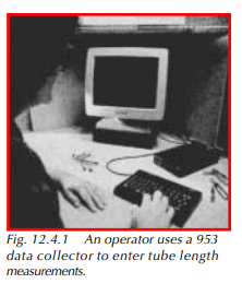  An operator uses a 953 data collector to enter tube length measurements